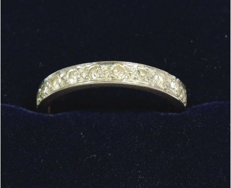 An 18 carat white gold half eternity ring set diamonds, size N/O, total weight 2.8g 