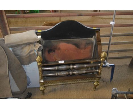 A brass and cast iron fire grate
