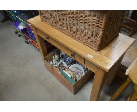 A light oak effect table fitted single drawer