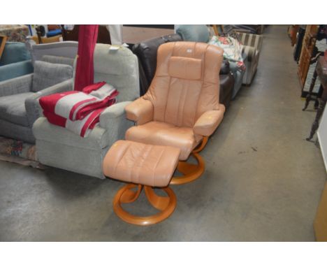 A light brown upholstered swivel chair and matching foot stool