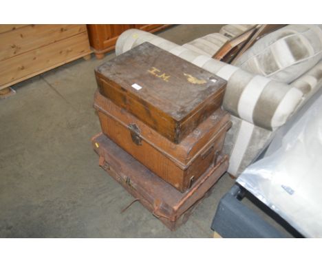 A leather bound trunk; together with a metal trunk and a wooden box