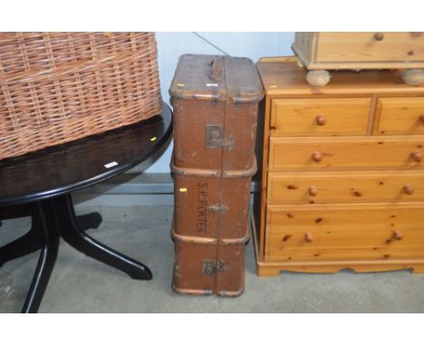 A metal and wooden bound travelling trunk