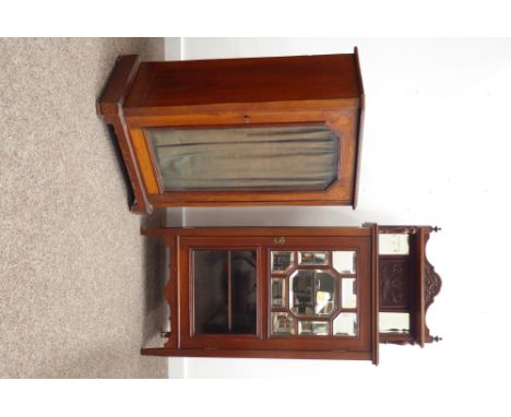 Edwardian mahogany sheet music cabinet, raised glazed and carved back with arched pediment, above open shelf supported by tur