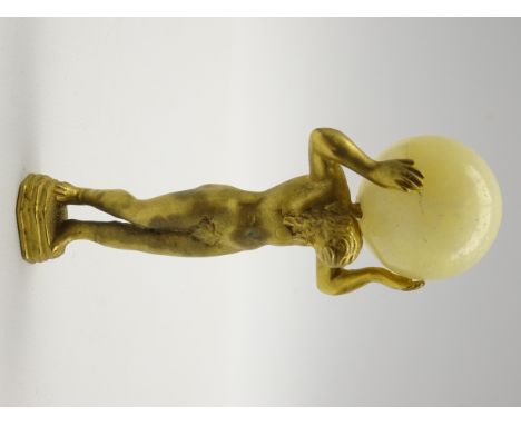 Gilt metal desk seal in the form of Atlas, his hands supporting an alabaster globe and with monogrammed base H9.5cm Condition