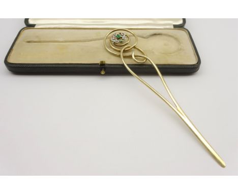 Late Victorian ladies silver gilt letter opener of scroll design, with decoration of a white enamel flower head set with an e