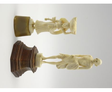 Carved ivory figure of Mahatma Ghandi on a wooden base H18cm and another ivory figure of a lady carrying a basket H13cm Condi