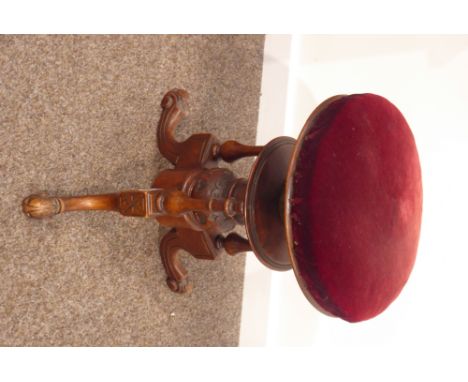 Victorian walnut revolving piano stool, rise and fall seat upholstered in red velvet, over acanthus leaf carved tripod base, 