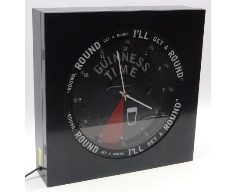 Rare Guinness time mains activated light up wall clock, of metal construction with lights on each hour, and inscribed 'Round,