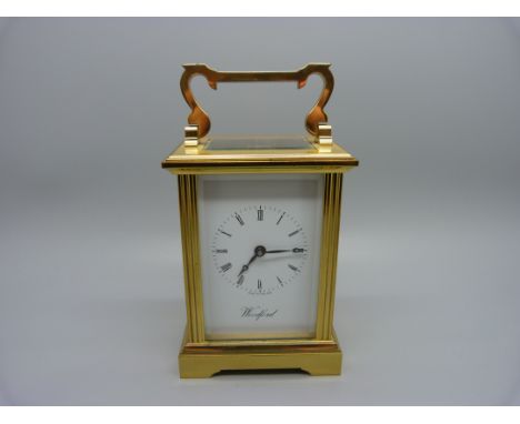 A Woodford brass and four glass sided carriage clock, with presentation plaque 