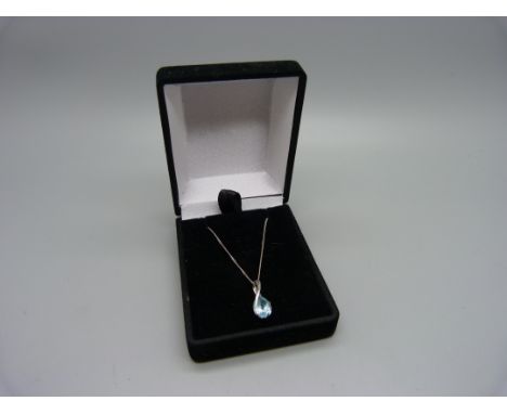 A 9ct white gold and topaz pendant and chain, 2.3g 