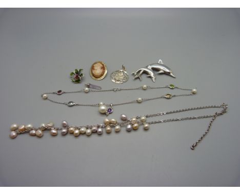 A 925 silver dolphin brooch, two necklaces, a silver and enamel flower pendant, etc. 