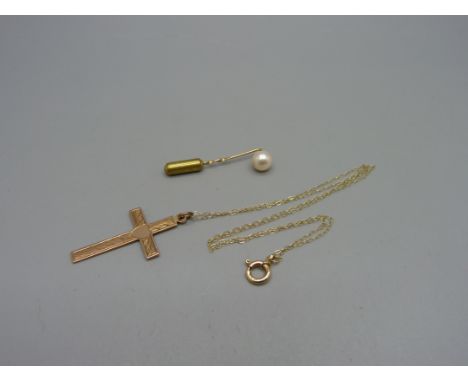 A 9ct gold cross pendant on chain, 2.4g, and a hallmarked 9ct gold and pearl stick pin, 0.7g 