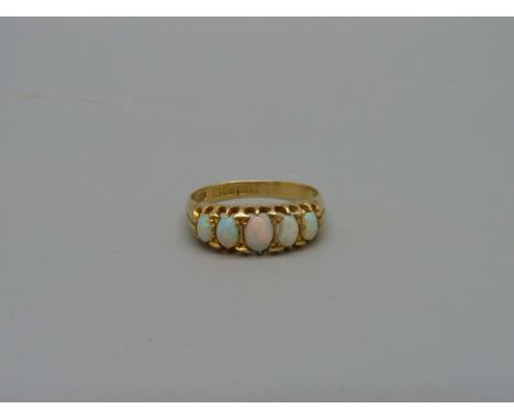 A Victorian 18ct gold, five stone opal ring, Birmingham 1864, 2.7g, K, one opal a/f 