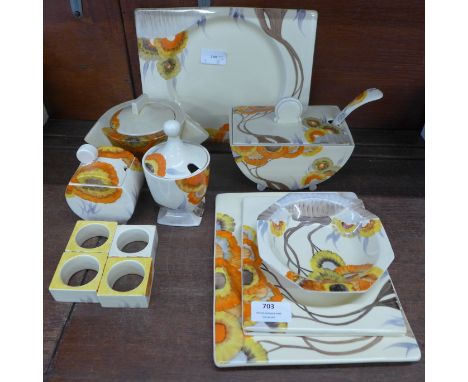Clarice Cliff The Biarritz Rhodanthe pattern tablewares, four rectangular platters, a dessert dish, conical sugar basin, grav