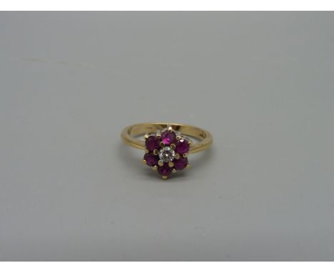 A 14ct gold, ruby and diamond cluster ring, marked 585, 3.2g, O 