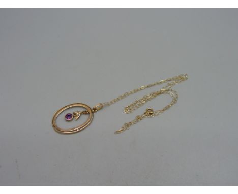 An Edwardian 9ct gold, amethyst and pearl pendant on a 9ct gold chain, 1.2g 