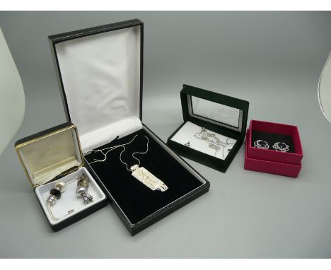 A pair of Pia silver earrings, a silver charm bracelet, a silver jewellery set and a silver pendant and chain 