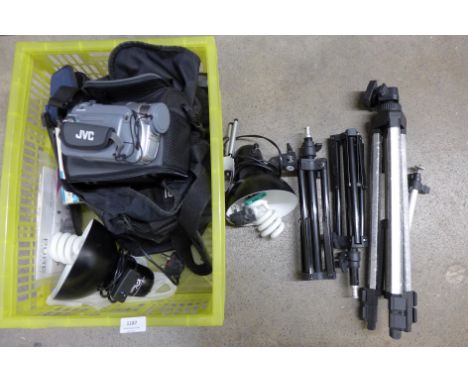 Camera equipment including tripods, lights, a video and a point and shoot camera **PLEASE NOTE THIS LOT IS NOT ELIGIBLE FOR P
