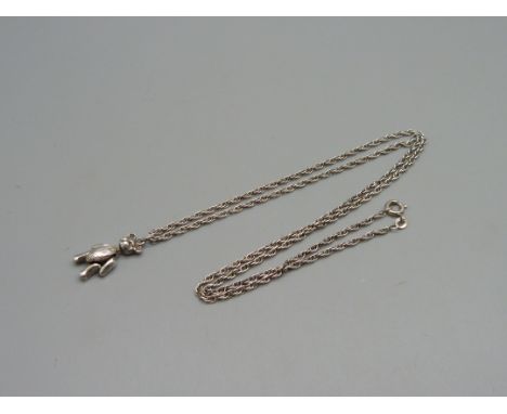 A jointed silver Teddy bear pendant on a 24" silver chain 