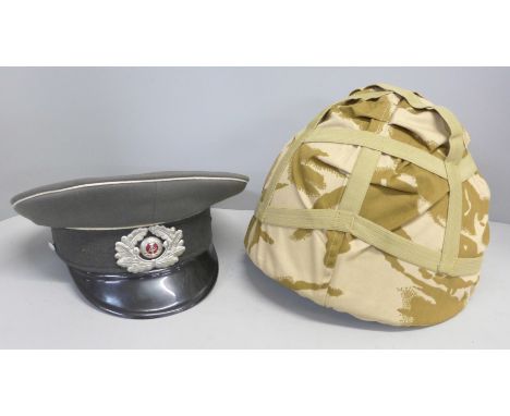 A post war Soviet army peaked cap and a helmet 
