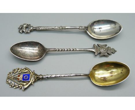 Two silver regimental spoons and a silver and enamel rifle shooting spoon, 48g 