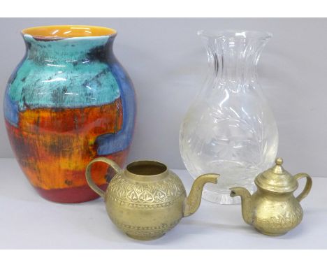 A Poole Pottery Gemstones pattern vase, crystal vase and two brass teapots, one lacking lid 