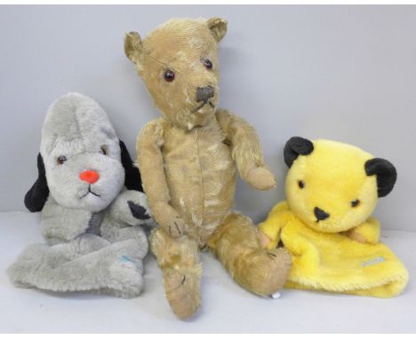 An early 20th Century Teddy bear and two modern Sooty and Sweep glove puppets, with squeak 