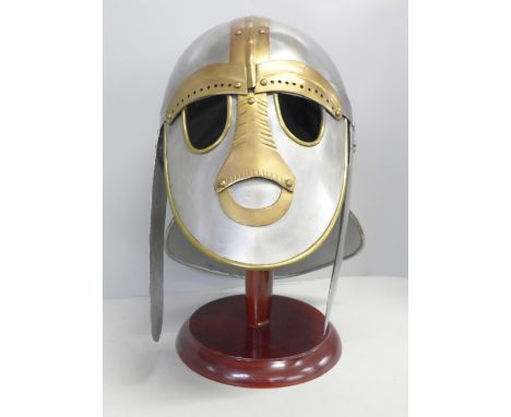 A 'Sutton Hoo' replica helmet and stand 