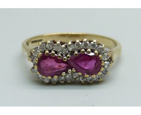 A 9ct gold, two ruby and diamond ring, 2.3g, M/N 