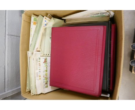 A box of empty stamp albums, albums with stamp collecting newsletters, two albums of first day covers and a collection of loo