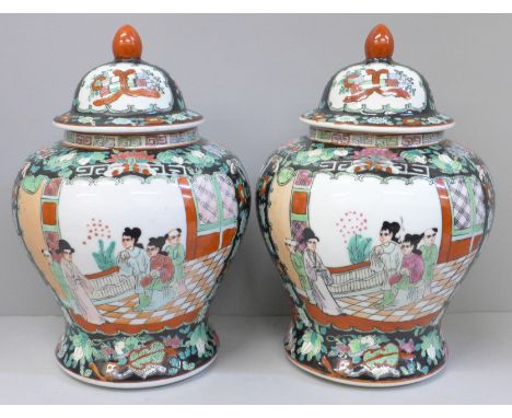 A pair of Chinese porcelain famille verte jars with covers, 27cm 