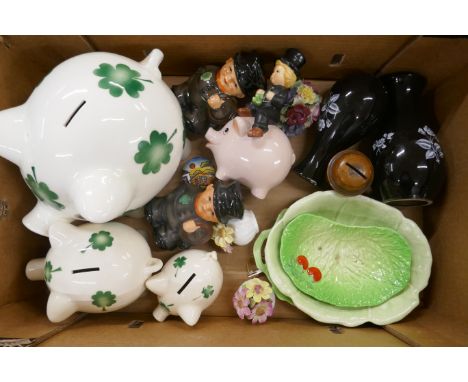 A set of three graduated Goebel piggy banks, one with chip to foot, a pair of Goebel chimney sweep money banks, two Wade vase