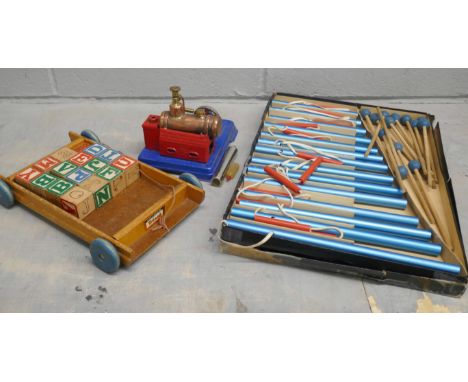 A Japanese Linemar Toys model steam engine, a Tri-ang wooden block pulley toy and a Boys Brigade Tubular Bells instrument 