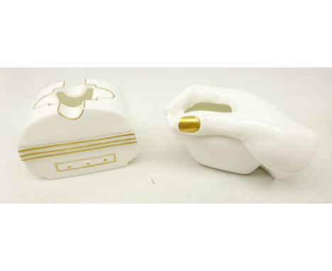 Two 1950's stylised porcelain ashtrays, one in the form as a female hand and the other Deco style with gilt decoration, made 