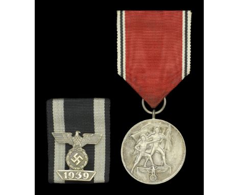 A German Second World War Bar to the Great War Iron Cross, with accompanying Entry into Austria Medal. A nicely cased 25mm wi