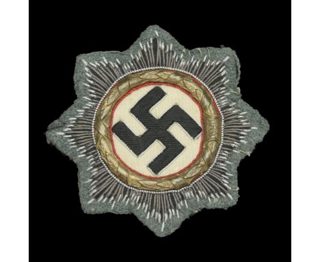 A German Second World War German Cross in Gold in Cloth. A good clean German Cross in gold, army version, field grey green wo