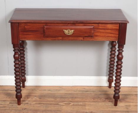 A mahogany bobbin leg side table with singular draw.Hx75cmWx90cmDx39cm  