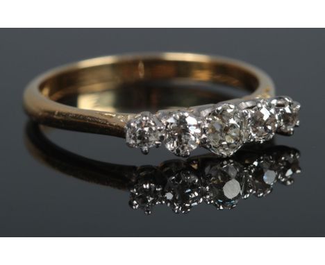 A large 18ct Gold five stone Diamond ring, the largest stone being approximately Â¼ct. Size S. Total weight: 3.8g  