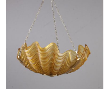 An art deco oyster style glass lamp shade. Approximately 19cm x 33cm.  No damages.