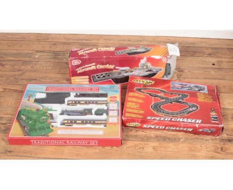 Three boxed toys. Includes Chad Valley Aircraft Carrier, Fastlane Racing Speed Chaser set and a Traditional Trainset.  