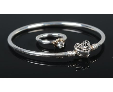 A silver Pandora 'Bubble Halo' ring, size K, together with a silver and cubic zirconia 'Heart and Butterfly' bangle. Total we