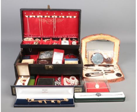 A black Mele cantilever jewellery box with contents of mostly costume jewellery. To include beaded necklaces, cufflinks, brac