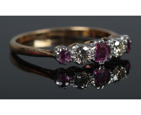 An 18ct Gold five stone Ruby and Diamond ring. Size K. Total weight: 2.1g.  