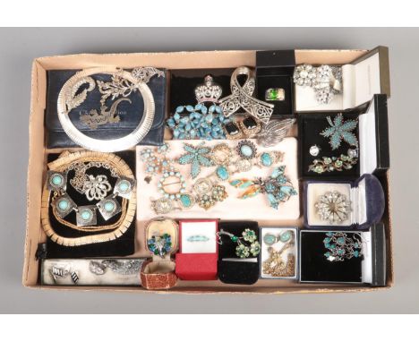 A tray containing an assortment of vintage costume jewellery, including enamel cufflinks, peacock brooch, turquoise set examp