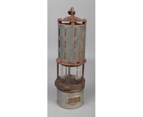 A vintage miners lamp stamped F.XSI no. 5186/80 featuring pierced hood and identity No.58.  