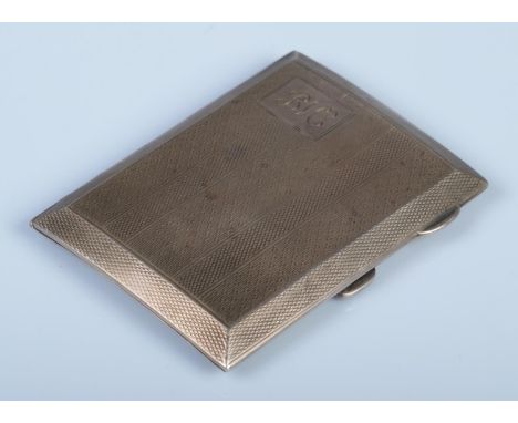 A silver hinged cigarette case, with monogram initials 'BVC' and engine decoration. Assayed for Birmingham, 1924 by Herbert B