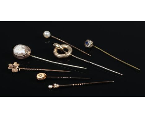 Seven Victorian stick pins, including Cameo, shamrock and seed pearl set examples.  