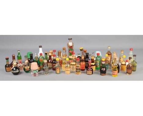 A large quantity of alcohol miniatures, to include Freezomint Creme De Menthe, Pernod, Malibu, Teachers Scotch and Royal Cham