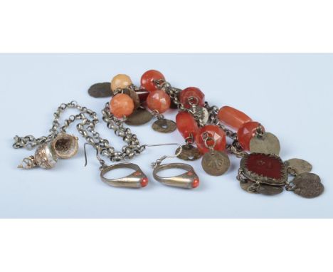 Three pieces of assorted jewellery, to include Indian gilt compass, coral hooped earrings and Eastern carnelian necklace.  