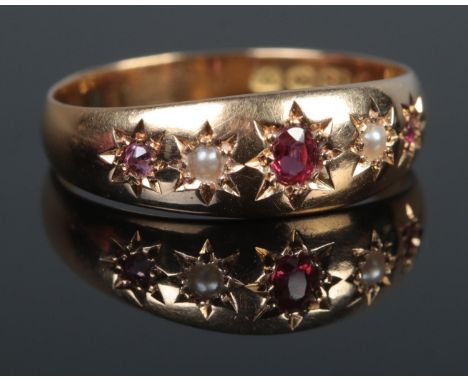 An 18ct Gold, Ruby and Pearl gypsy set ring. Size O. Total weight: 2.8g  